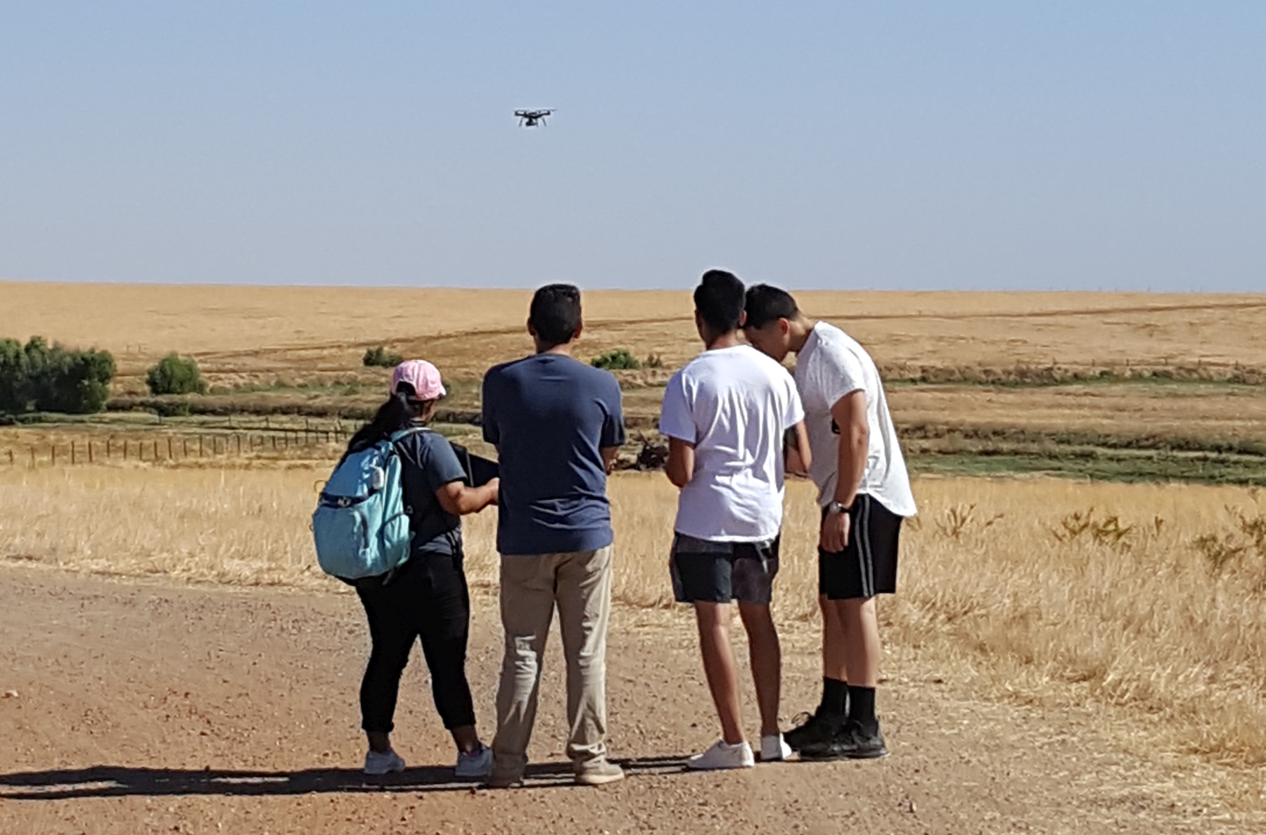 Students flying UC-owned UAS for coursework on a University Location
